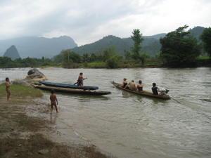 crossing the river by longboat