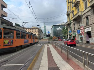 At tram stop in Milan