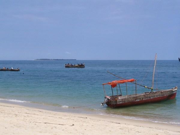 Local style boats with one of the islands behind