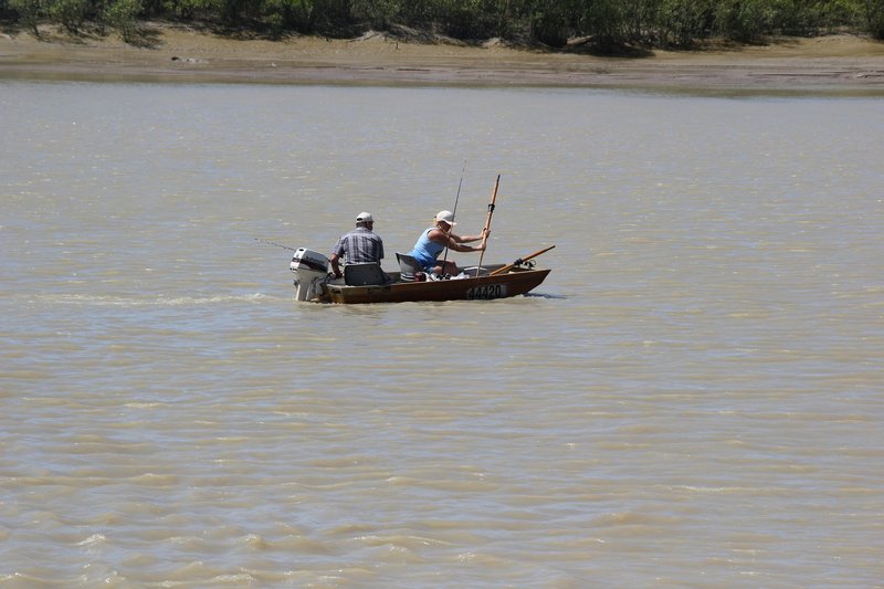 A couple going fishing at South Adelaide River - don't think that boat is big enough