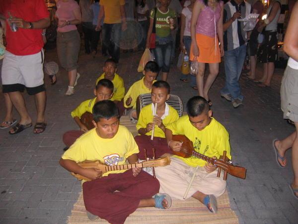 School kids playing the Sunday Night Market