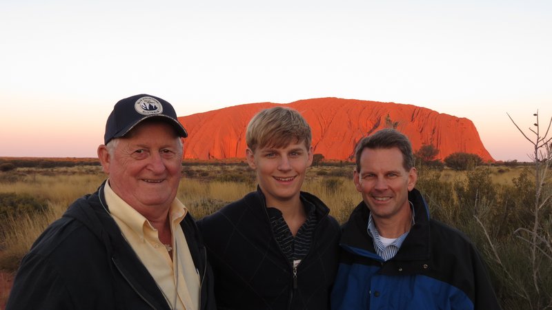 Cindy's Dad, Michael and I at sunset in front of Ayers Rock