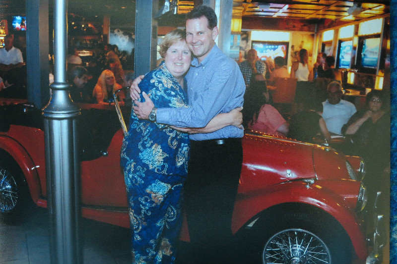 Cindy and I posing in front of a car located in the Royal Promenade