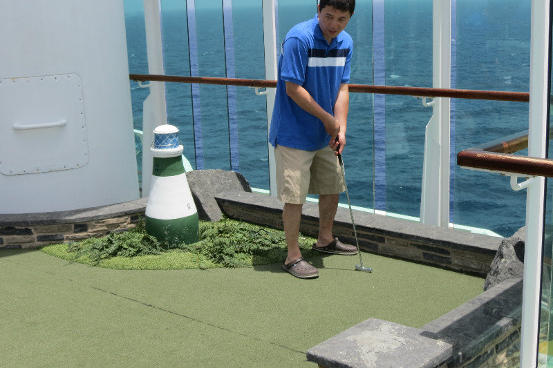Charles Guo playing in the mini-golf tournament 