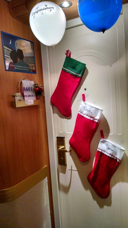 Our Christmas decorations on our cabin door. Michael also has a stocking on his door.