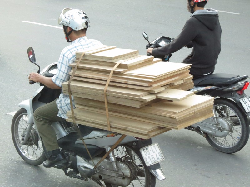 Mopeds can do anything, hauling lumber