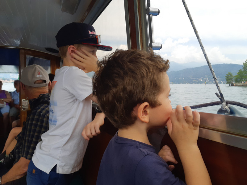 Liam and Oliver engrossed in what was happening outside the boat
