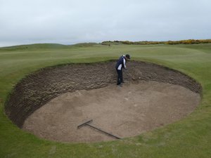 Massive bunker and ball up against the wall - tough shot!