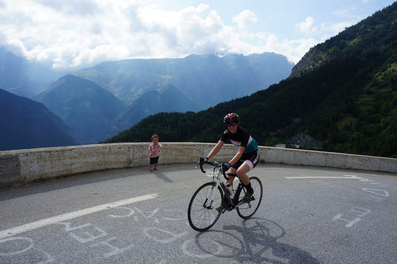 With the Rhone ALps in the background Liam is cheering his mum on up the Alp Duez