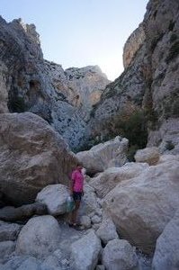 Climbing bolders in Gorropu Canyon is hard work