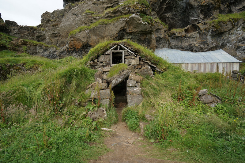 Families lived in these old turf and stone huts with grass roofs
