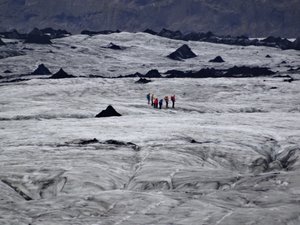 Walkers climbing on Solheimajokkull Glacier