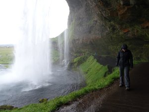 Walking in behind the Seljalandsfoss Waterfall