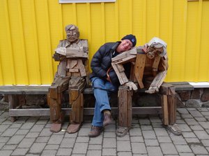 Three old men on a seat at Siglusfofdur Harbour