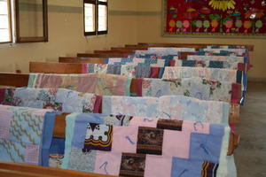30 quilts tacked and ready to Bind