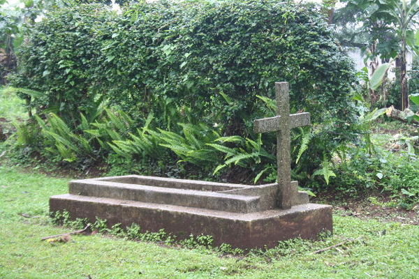 The grave in the yard out front