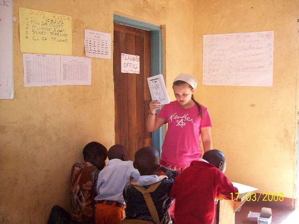 Emily teaching the children to Read in English