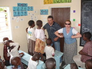 Greg & Kris teaching new songs to the Orphanage