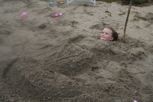 Gracie buried in the sand!