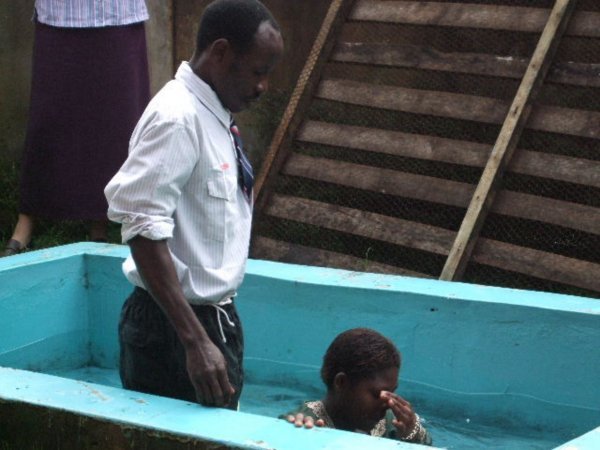 Neema being baptized 