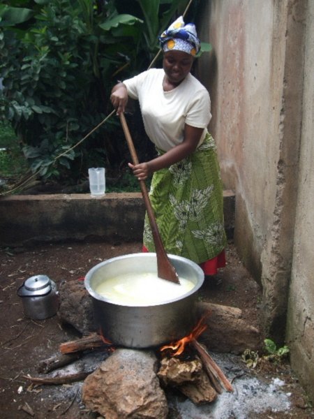 Sia stirring the rice... over the open stove