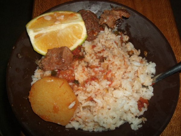 Rice & Beef with a potatoe and Orange slice