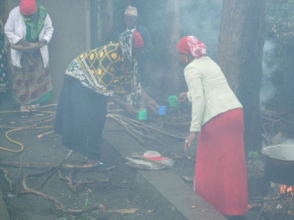The Ladies from the church preparing lunch out in the rain