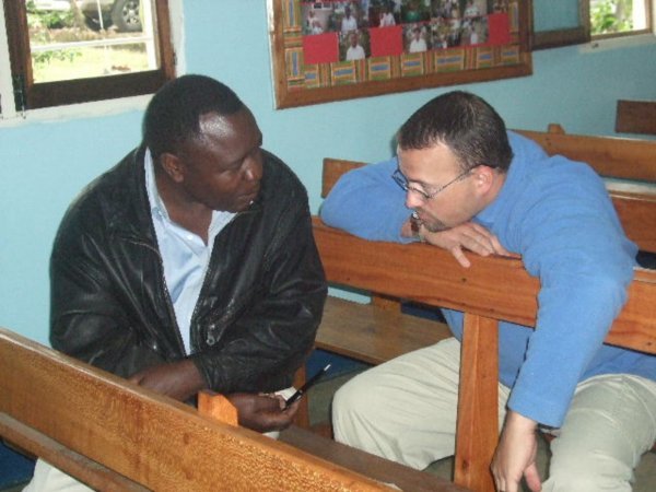 Carey visiting with members of the Arusha Congregation