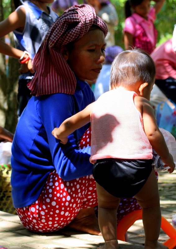 mother and child seek shade