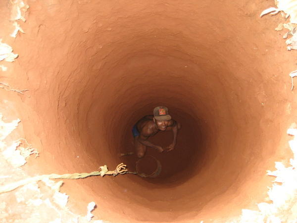 some fella digging a hole