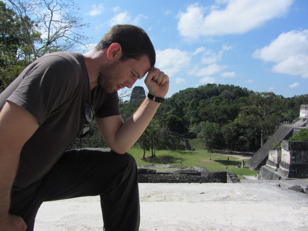 Tebowing with temple in background