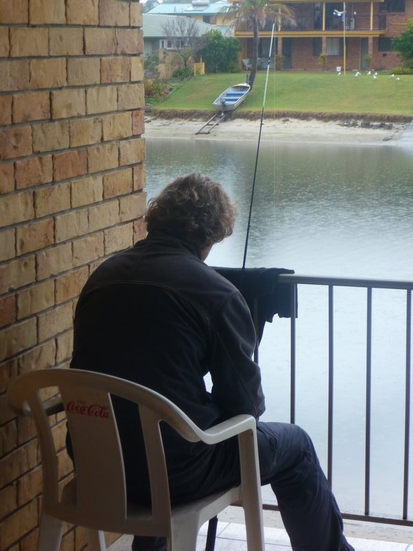 Stan fishing from Rohan and Jenea's balcony (he caught two big big fish!)