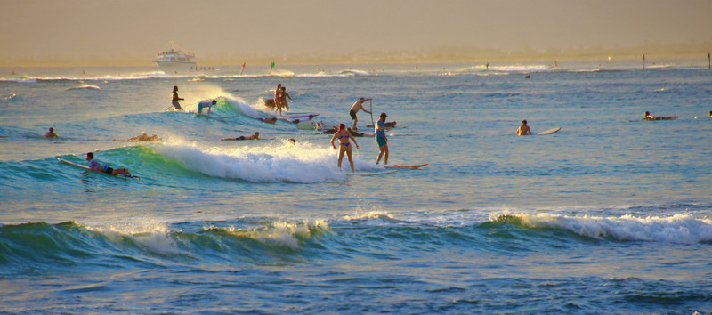 Sunset surfers at Waikiki