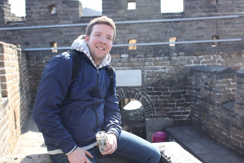 Colin enjoying a beer on the Great Wall of China!