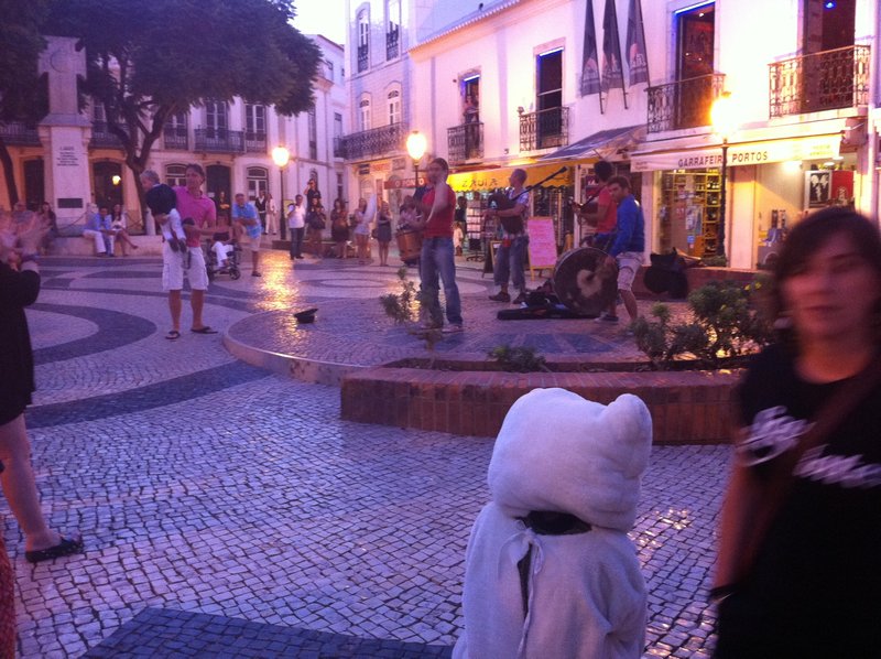 Street entertainers in Lagos... yes that is a person in a teddy bear suit!!