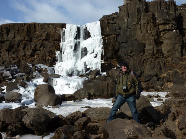 me in front of frozen waterfall