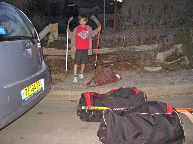 Unloading hockey bags at Merkaz Canada, Metula