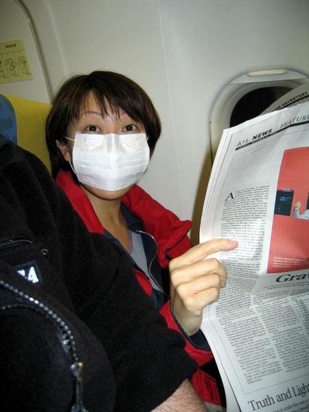 Masked person on plane