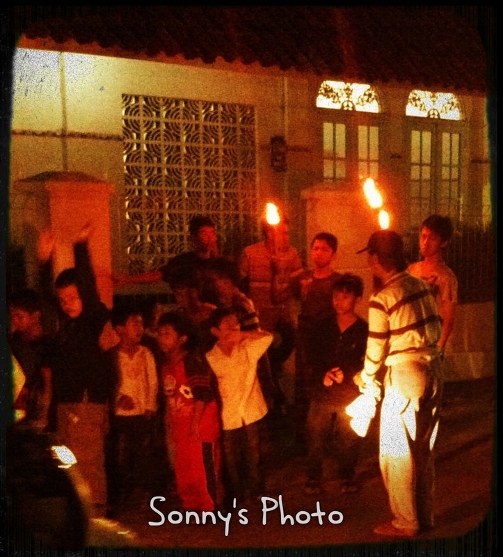 Kids with bamboo torch