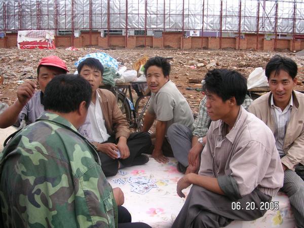workers take a moment to play cards