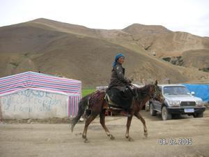 Tibetan lady on horse at check point