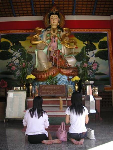 Girls praying at Temple