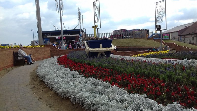 The flower beds and the rather large bucket and spade 