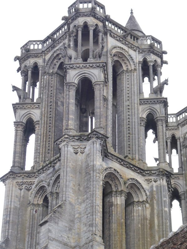 A tower on the cathedral all delicate and lace like 