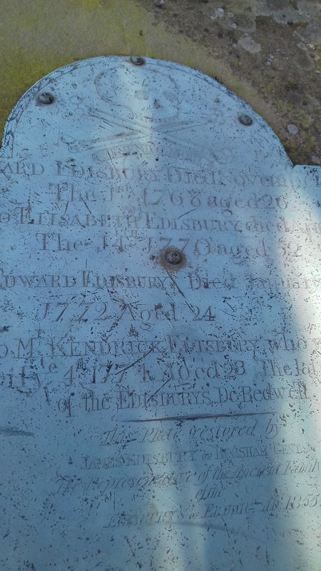 Copper grave plate on one of the graves 