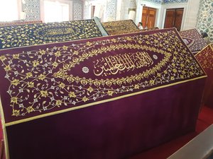 Intricate workings of calligraphy on each tomb 
