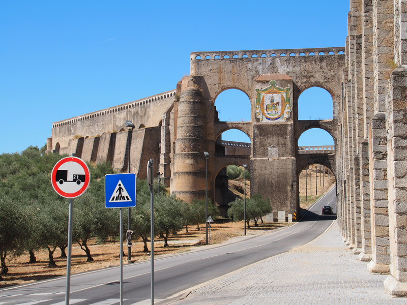 The road has to accomodate the aqueduct 
