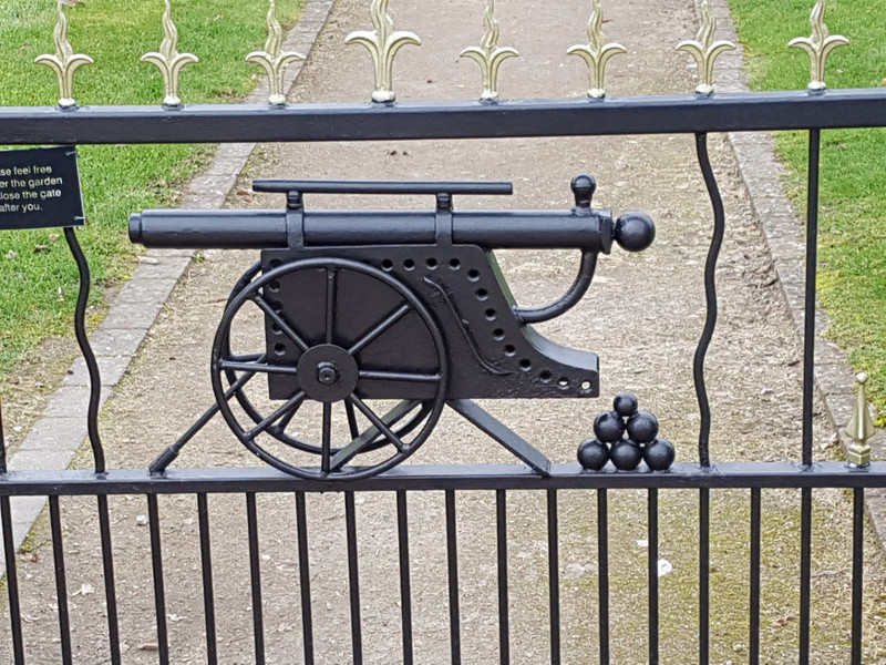 A wrought iron gate leading to a monument relating to the First World War 