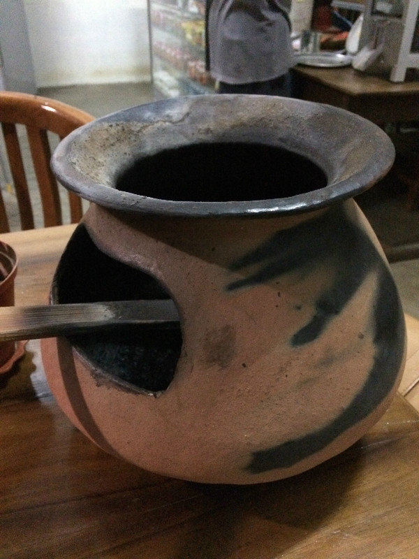 Traditional clay pot to roast coffee beans