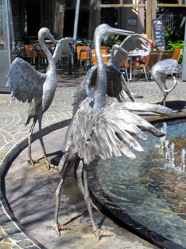 Fountain with playful feathered friends